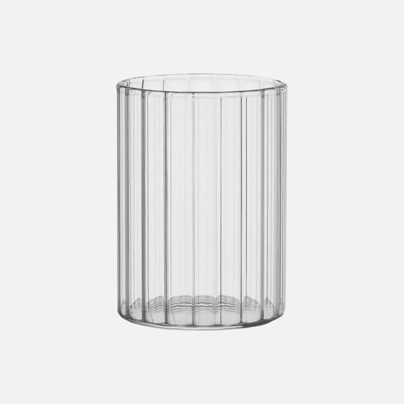 Modern ridged glass tumbler with vertical stripes, heat-resistant glass for hot and cold beverages