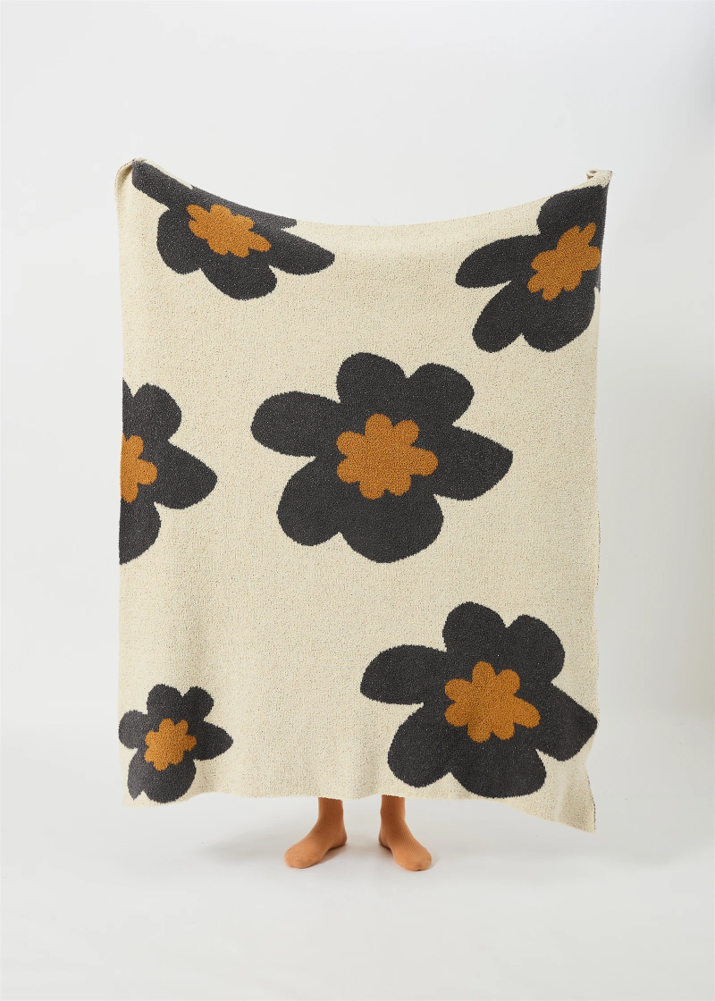 Floral microfiber knit throw blanket with a plush, modern design, anti-pilling, and wearable comfort