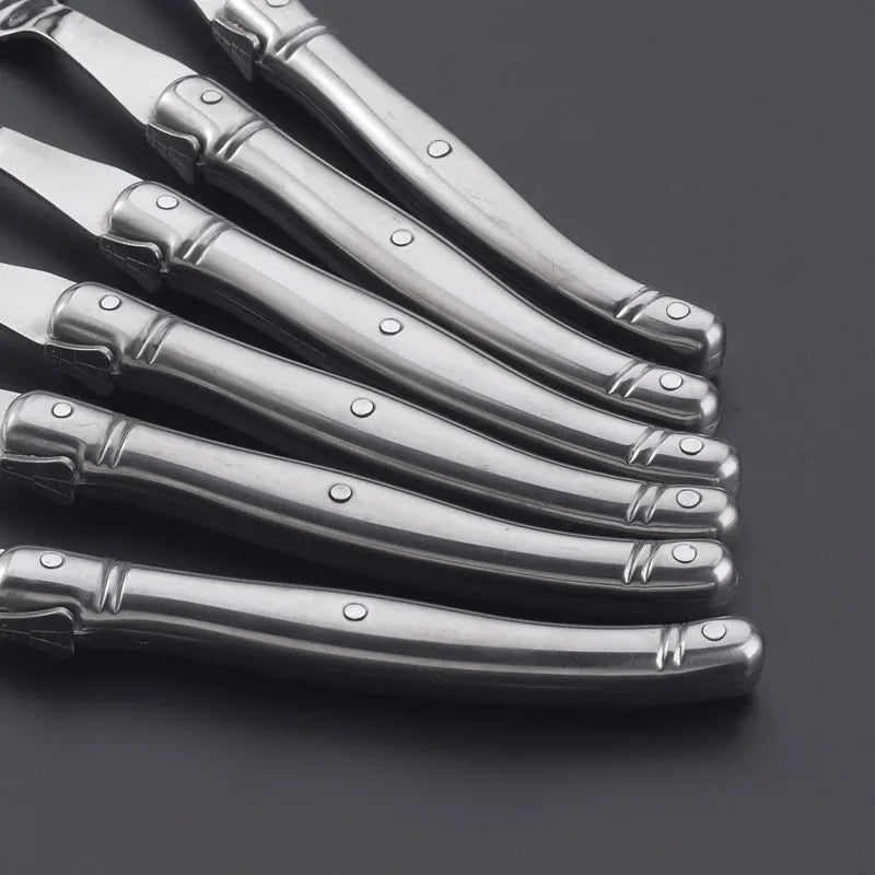 Elegant stainless steel flatware set with a polished finish, ergonomic handles, and precision steak knives