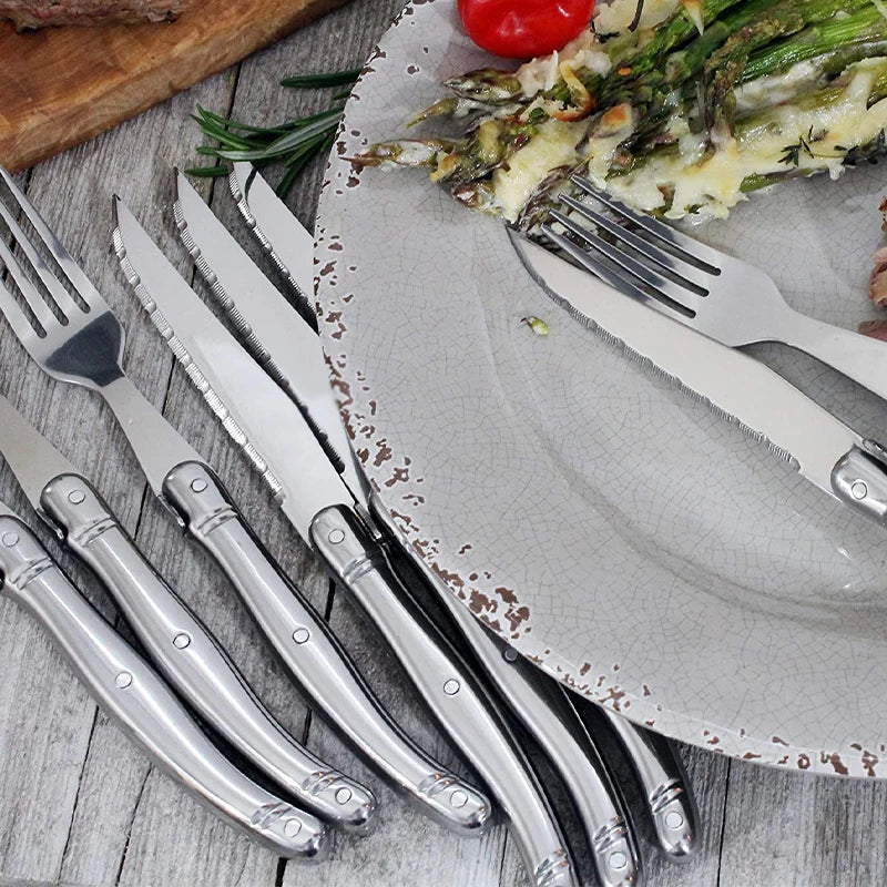 Elegant stainless steel flatware set with a polished finish, ergonomic handles, and precision steak knives