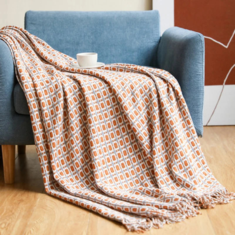 Vintage geometric knitted throw blanket with tassels in houndstooth and grid patterns