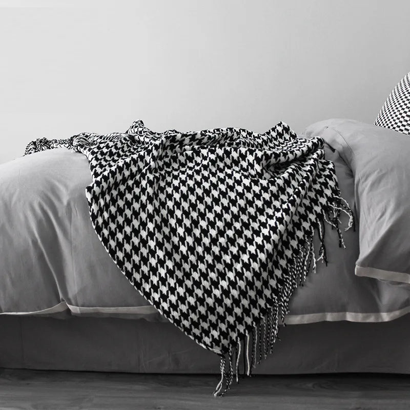 Vintage geometric knitted throw blanket with tassels in houndstooth and grid patterns