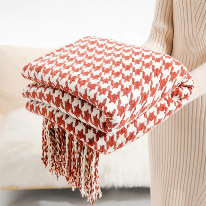 Vintage geometric knitted throw blanket with tassels in houndstooth and grid patterns