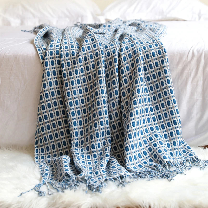 Vintage geometric knitted throw blanket with tassels in houndstooth and grid patterns