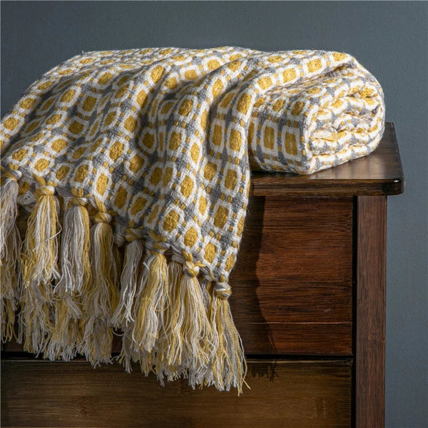 Vintage geometric knitted throw blanket with tassels in houndstooth and grid patterns