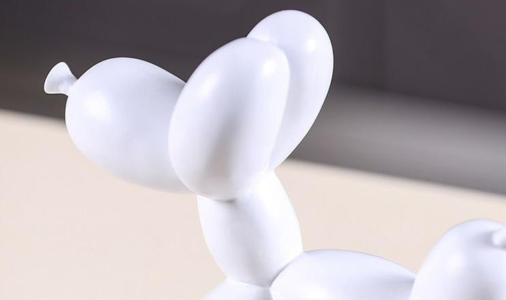 white Jeff Koons balloon dog sculpture decor