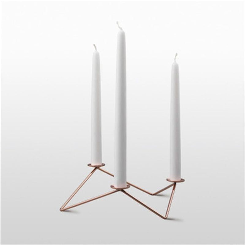 Metal candle holder for three candles