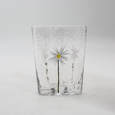 textured blown glass with flower design and gold rim kettle and cups