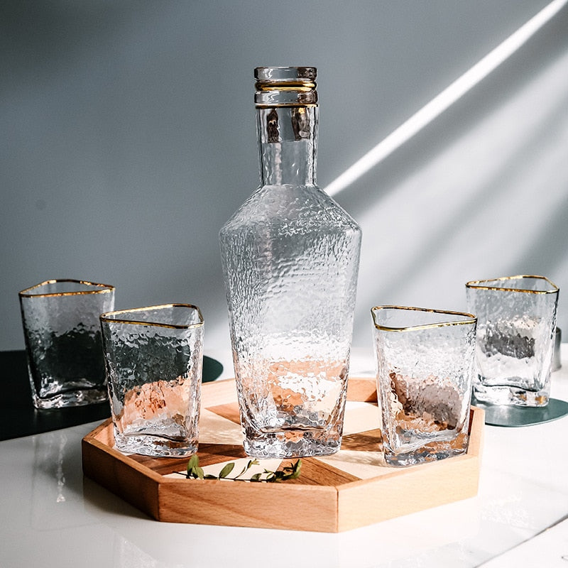 textured blown glass with flower design and gold rim kettle and cups