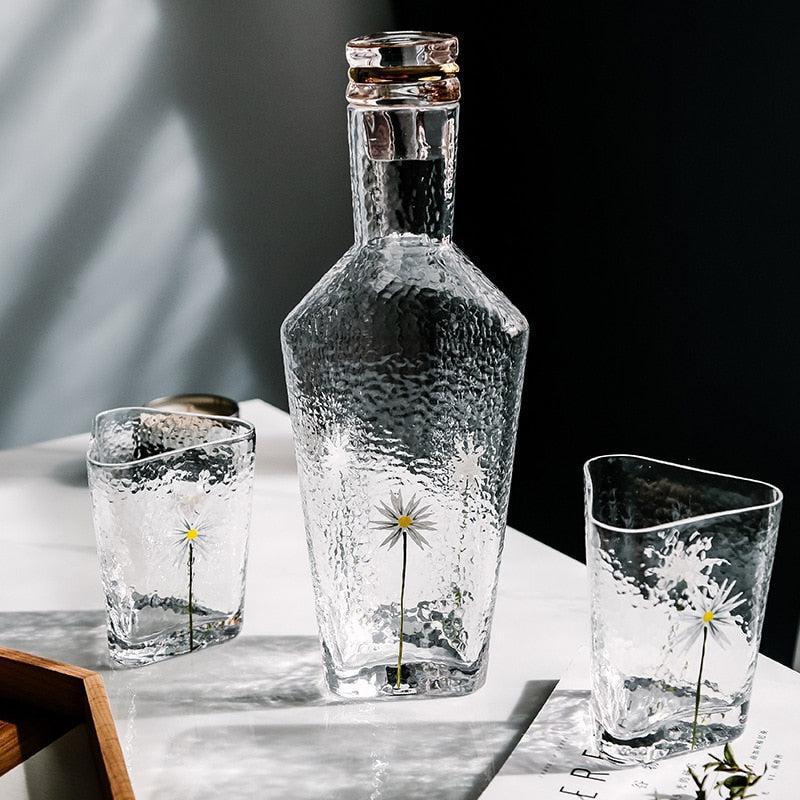 textured blown glass with flower design and gold rim kettle and cups