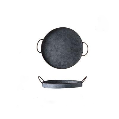 round black casted iron tray