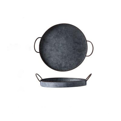 round black casted iron tray