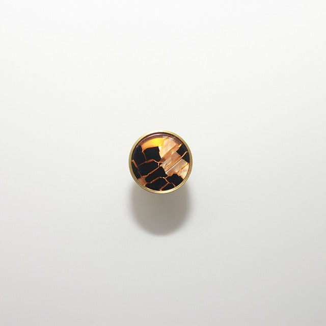 round color marbled brass cabinet knob and pulls