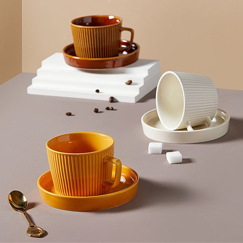 round textured stripe brown orange white ceramic cup with matching saucer