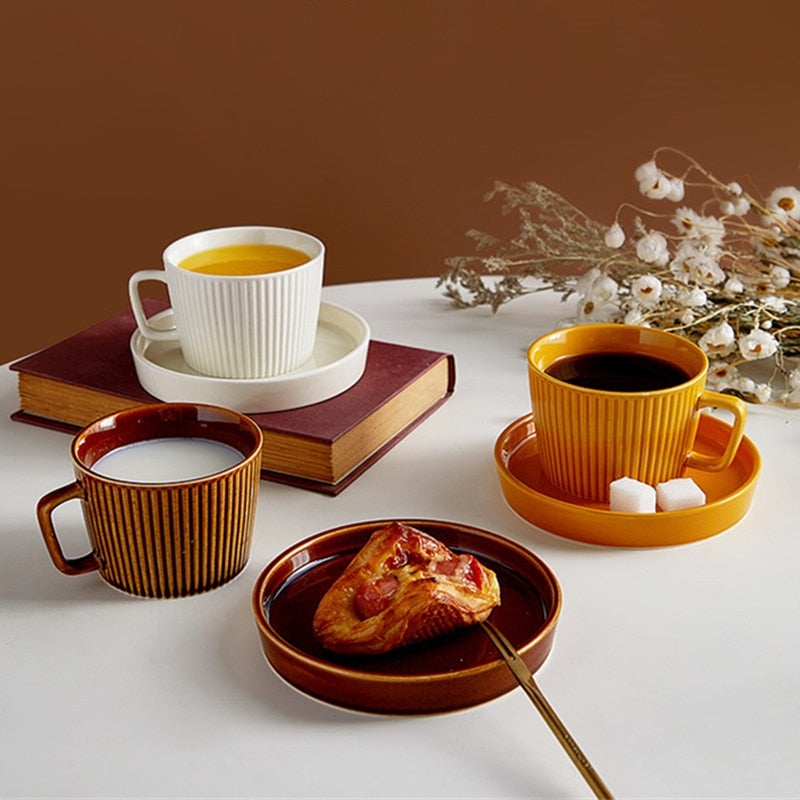 round textured stripe brown orange white ceramic cup with matching saucer