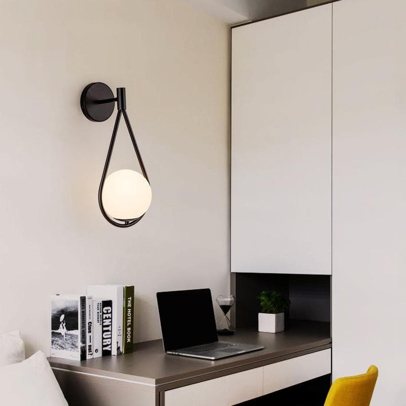 black loop shape wall lamp with a Frosted glass globe 