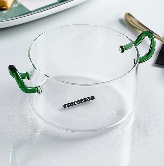 round clear crystal bowl with green handles