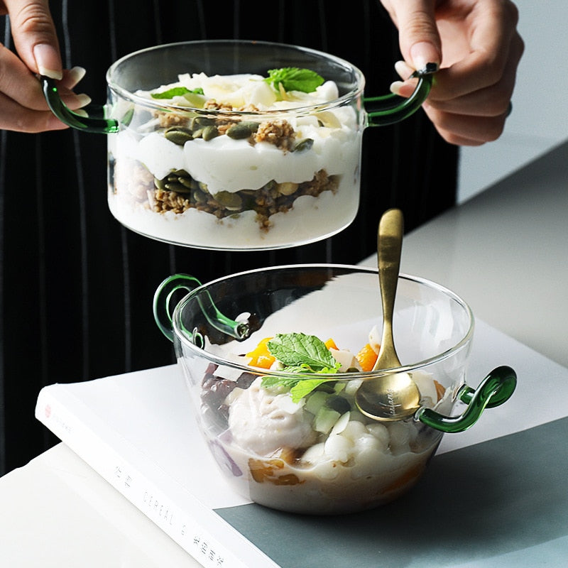 round clear crystal bowl with green handles