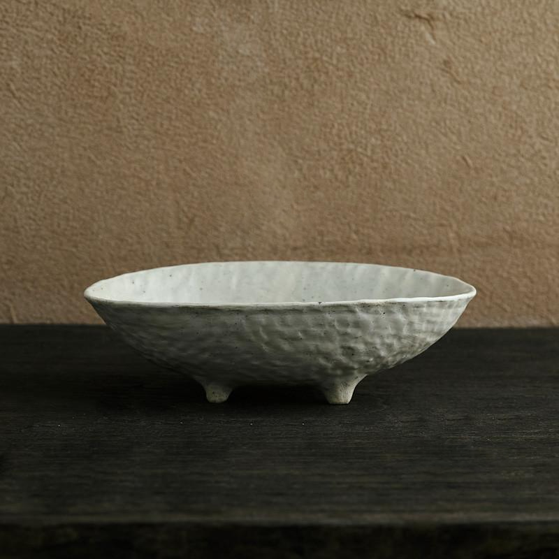 abstract round stone textured white ceramic bowl