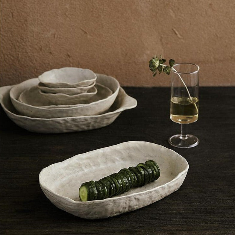 abstract round stone textured white ceramic bowls and plates