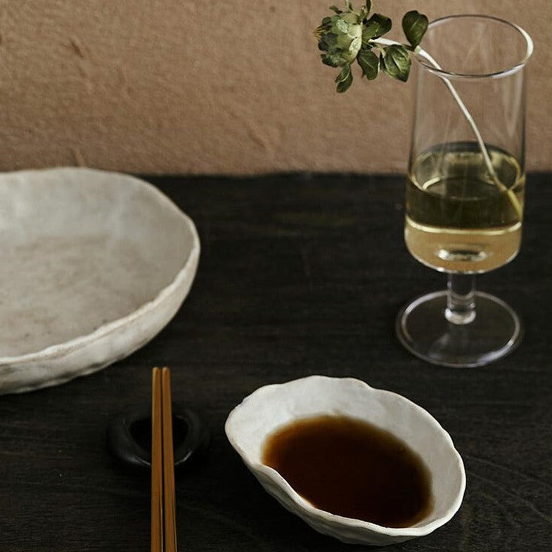 abstract round stone textured white ceramic bowls and plates