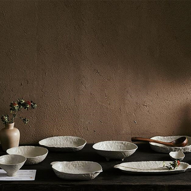 abstract round stone textured white ceramic bowls and plates