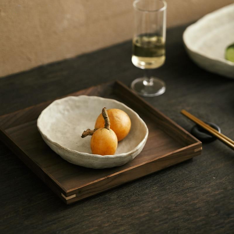 abstract round stone textured white ceramic bowls and plates