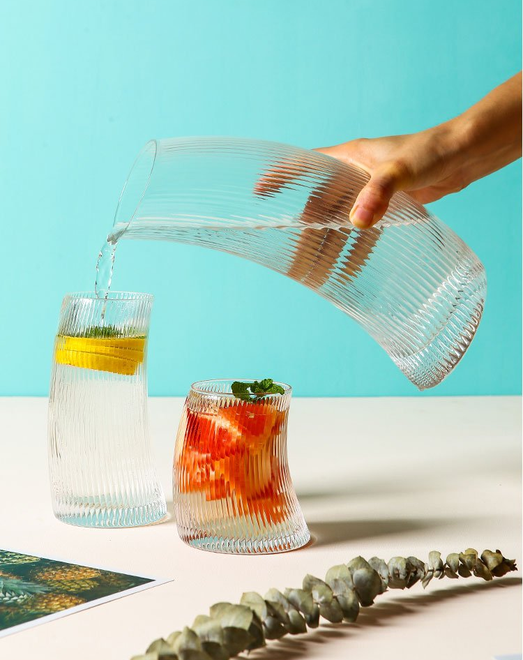 curved water or cocktail glass and jar