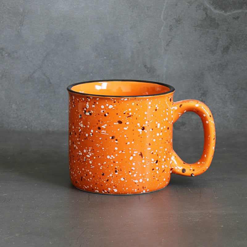 paint splatter ceramic mug orange green