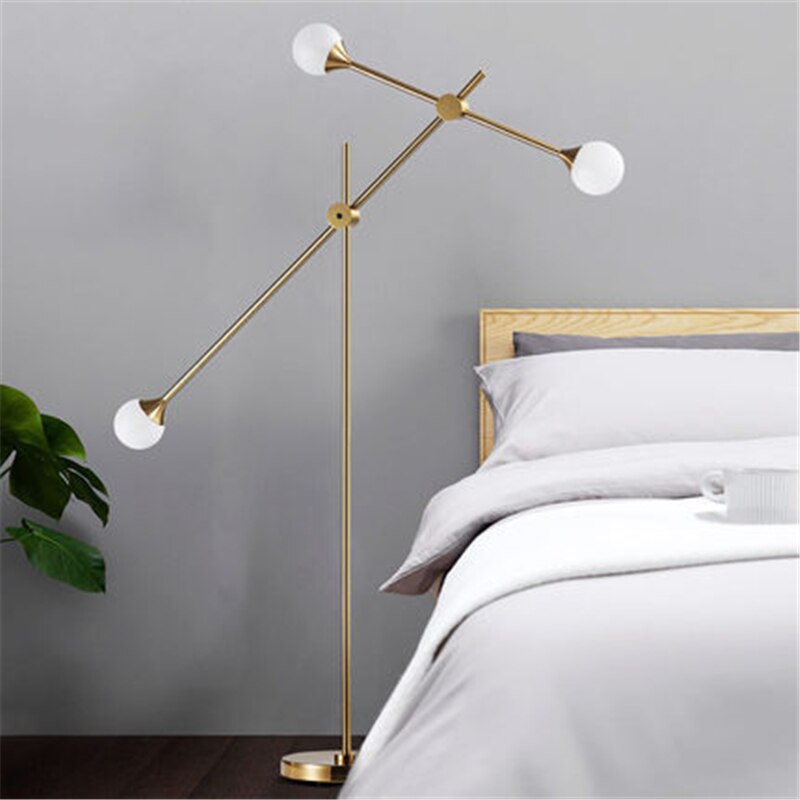 Three Bulb Dynamic Floor Lamp in Brass