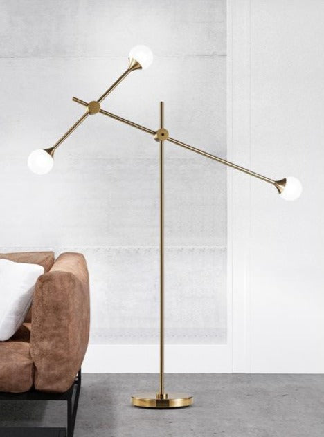 Three Bulb Dynamic Floor Lamp in Brass