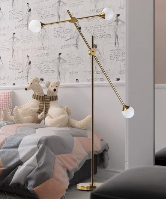 Three Bulb Dynamic Floor Lamp in Brass