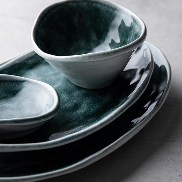 Glossy glazed teal blue green plates and bowls