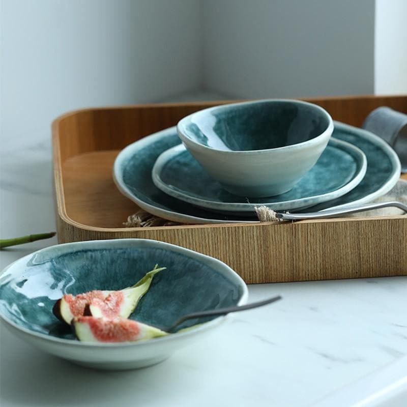 Glossy glazed teal blue green plates and bowls