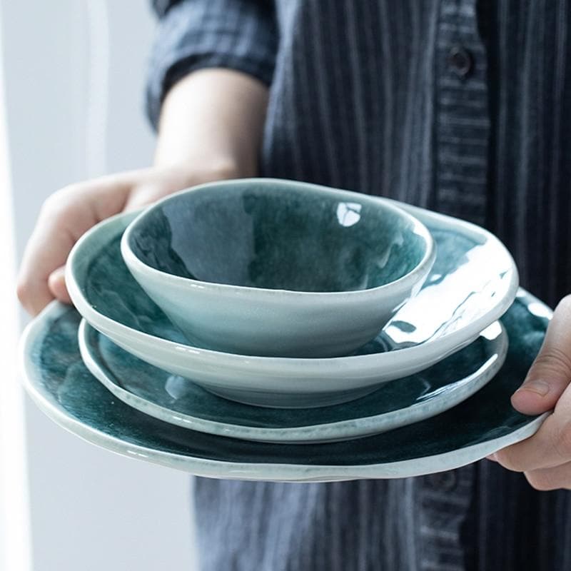 Glossy glazed teal blue green plates and bowls