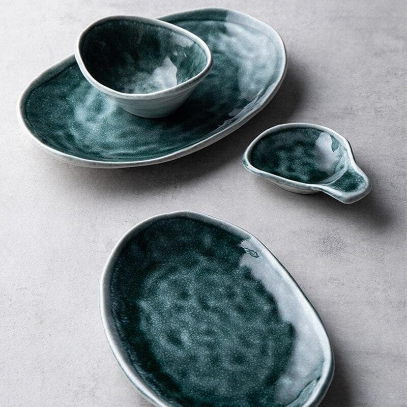 Glossy glazed teal blue green plates and bowls