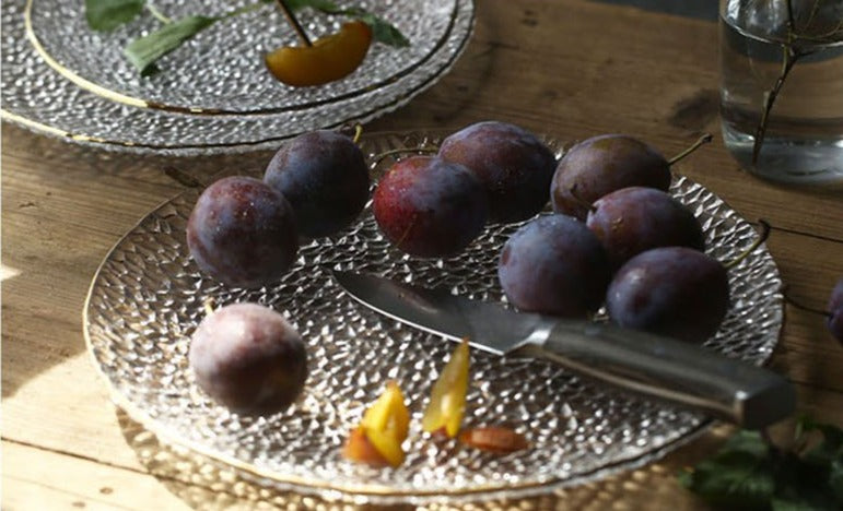 round textured hammered glass plate with gold trimming