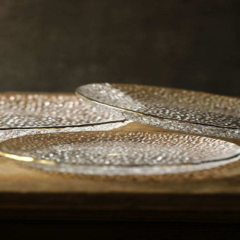 round textured hammered glass plate with gold trimming