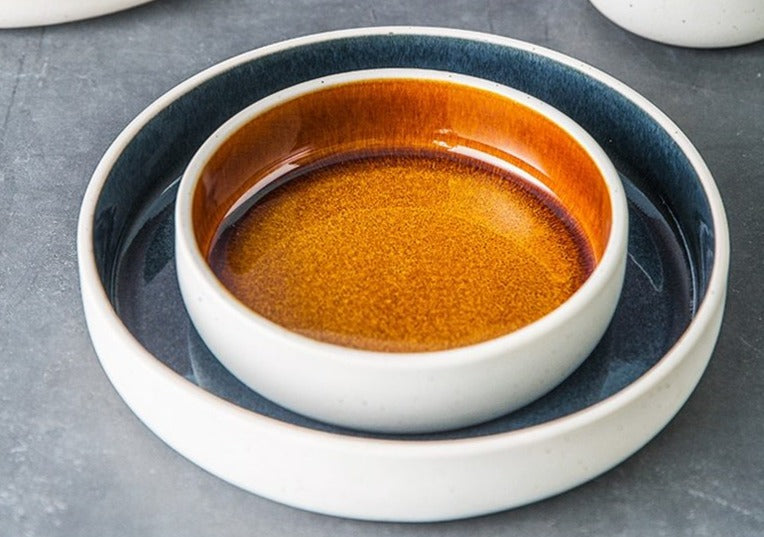 round orange blue ceramic plate and bowl