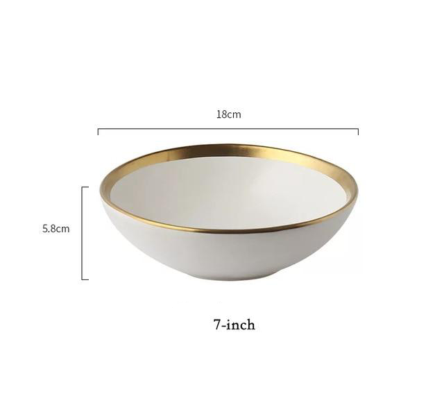 white bowl with gold rim